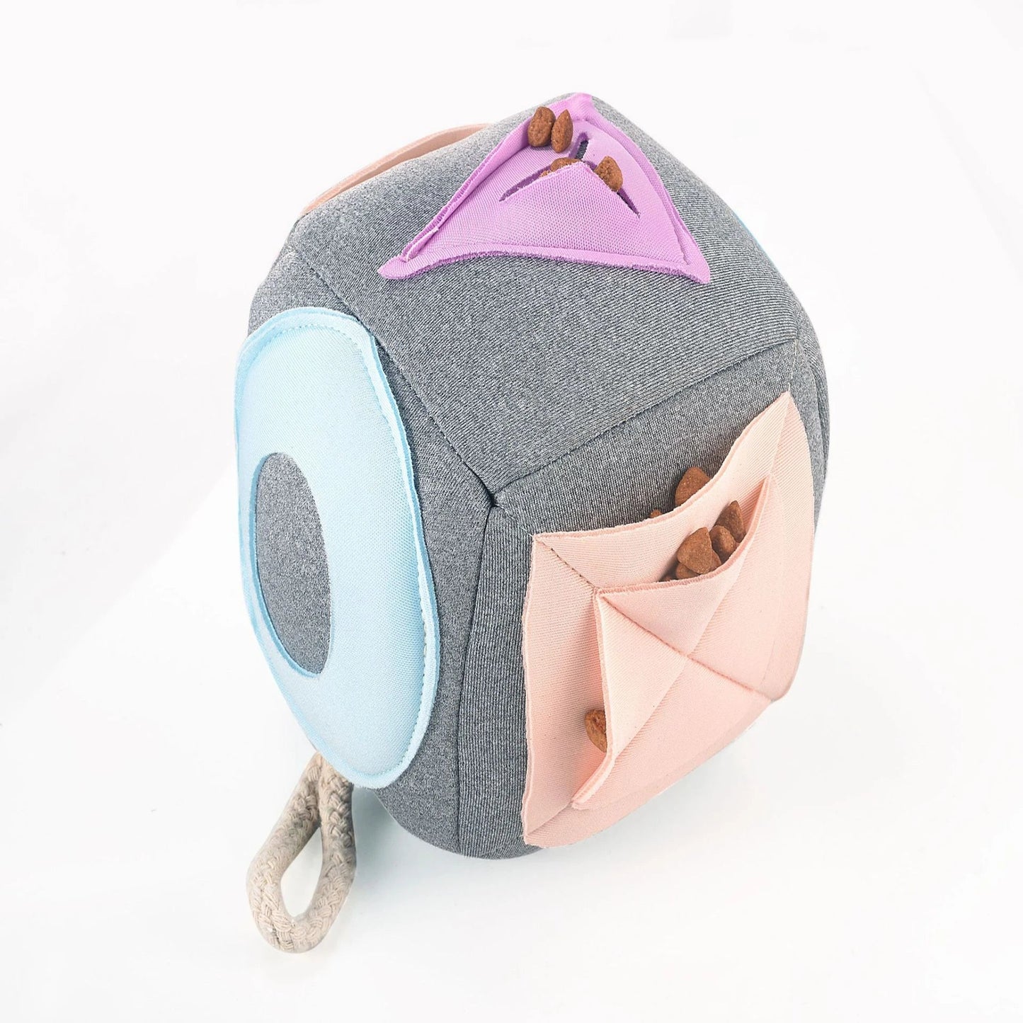 A grey snuffle pad with a soft, plush surface for hiding treats to stimulate a pet's natural foraging skills.