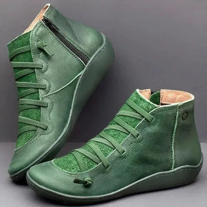 Women's casual booties with wedge heel and round toe in various colours like black and leopard print, showing rubber sole.