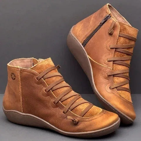 Women's casual booties with wedge heel and round toe in various colours like black and leopard print, showing rubber sole.