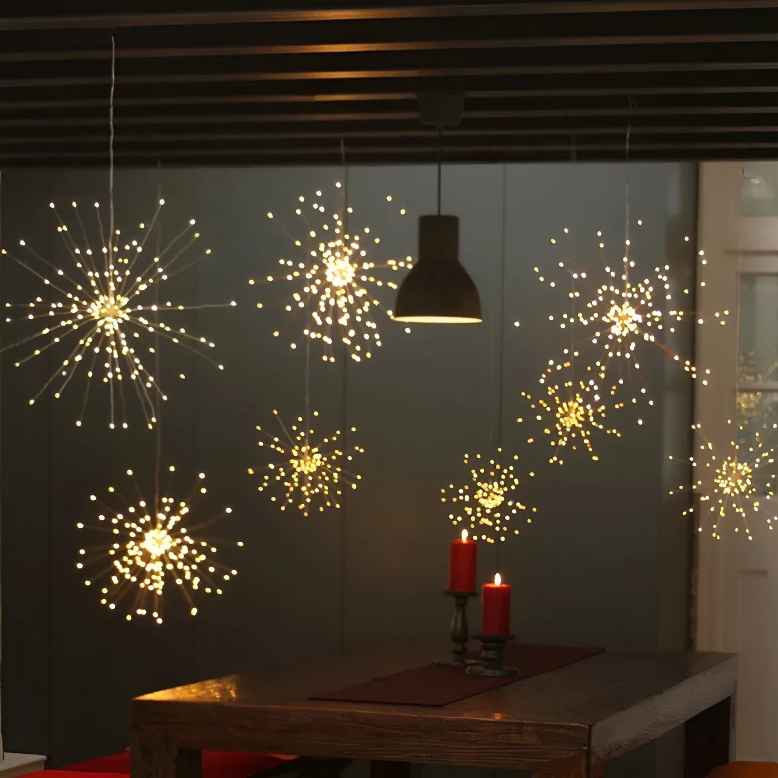 Solar-powered LED meteor shower light with firework effect, showing warm white lights on a PVC housing for outdoor use.