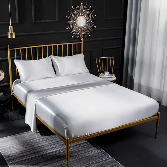 Ice silk bed sheet set in royal blue showing satin weave texture and reinforced corner stitching
