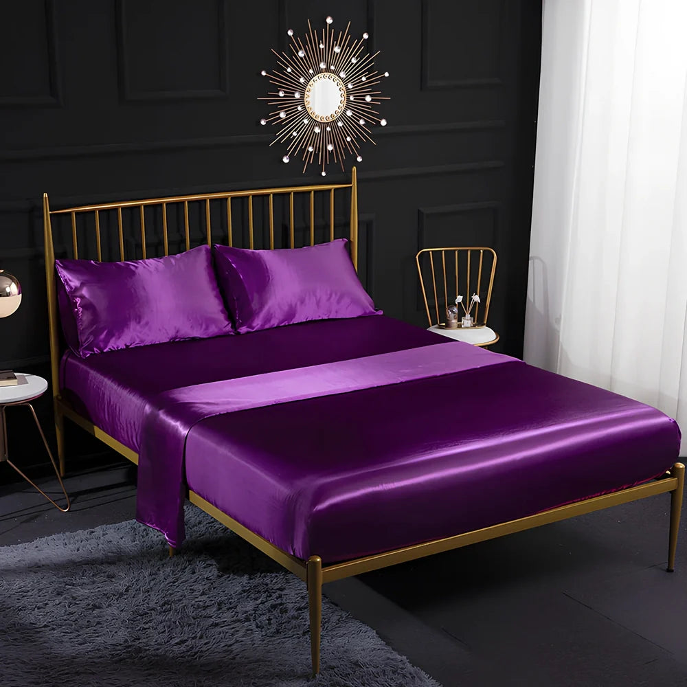 Ice silk bed sheet set in royal blue showing satin weave texture and reinforced corner stitching