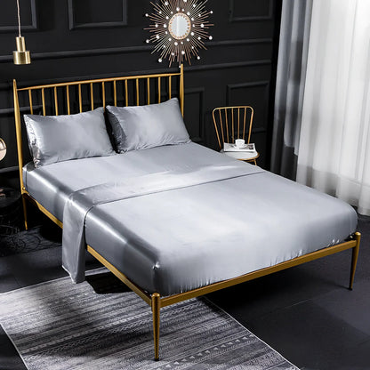 Ice silk bed sheet set in royal blue showing satin weave texture and reinforced corner stitching
