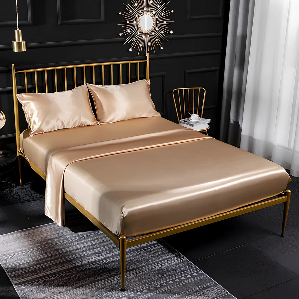 Ice silk bed sheet set in royal blue showing satin weave texture and reinforced corner stitching