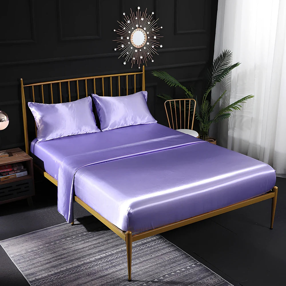 Ice silk bed sheet set in royal blue showing satin weave texture and reinforced corner stitching