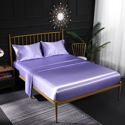 Ice silk bed sheet set in royal blue showing satin weave texture and reinforced corner stitching