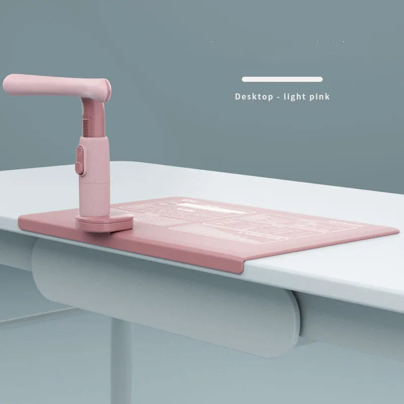 Children's ABS desk-mounted sitting posture corrector in blue, pink, or white for study desks.