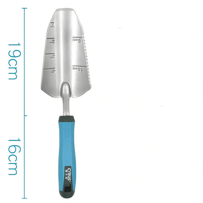 Aluminium garden tool set with cast shovel, three-claw harrow, and reinforced gardening gloves on soil