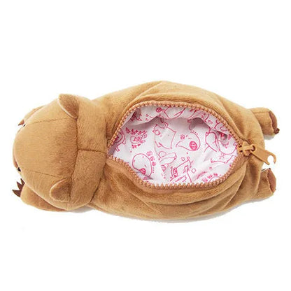 Soft brown plush pencil case with cartoon wombat design and a black zip.