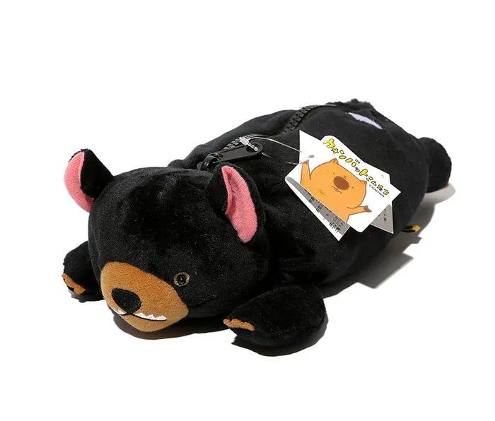 Soft brown plush pencil case with cartoon wombat design and a black zip.