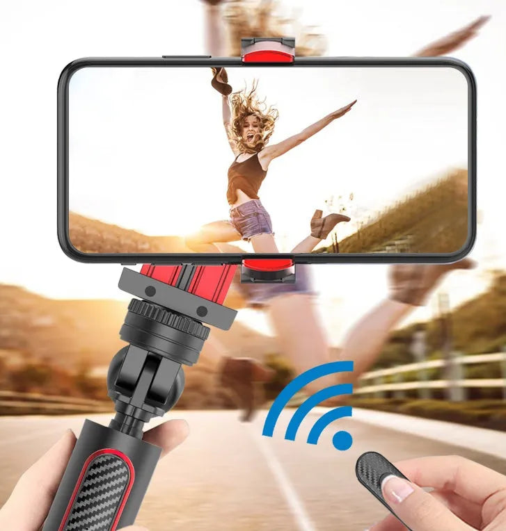 Black aluminium tripod extended to full height with a mobile phone clamped, showing the video stabiliser mechanism.