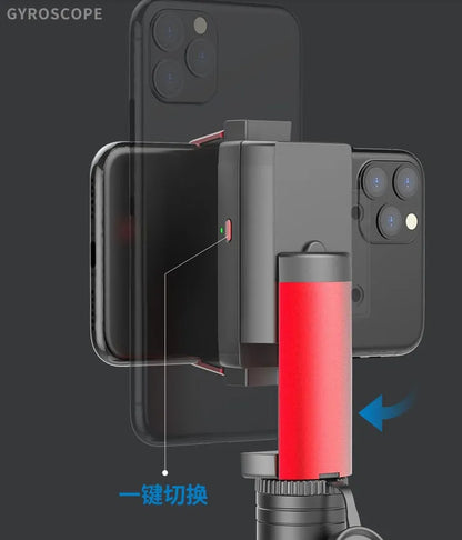 Black aluminium tripod extended to full height with a mobile phone clamped, showing the video stabiliser mechanism.