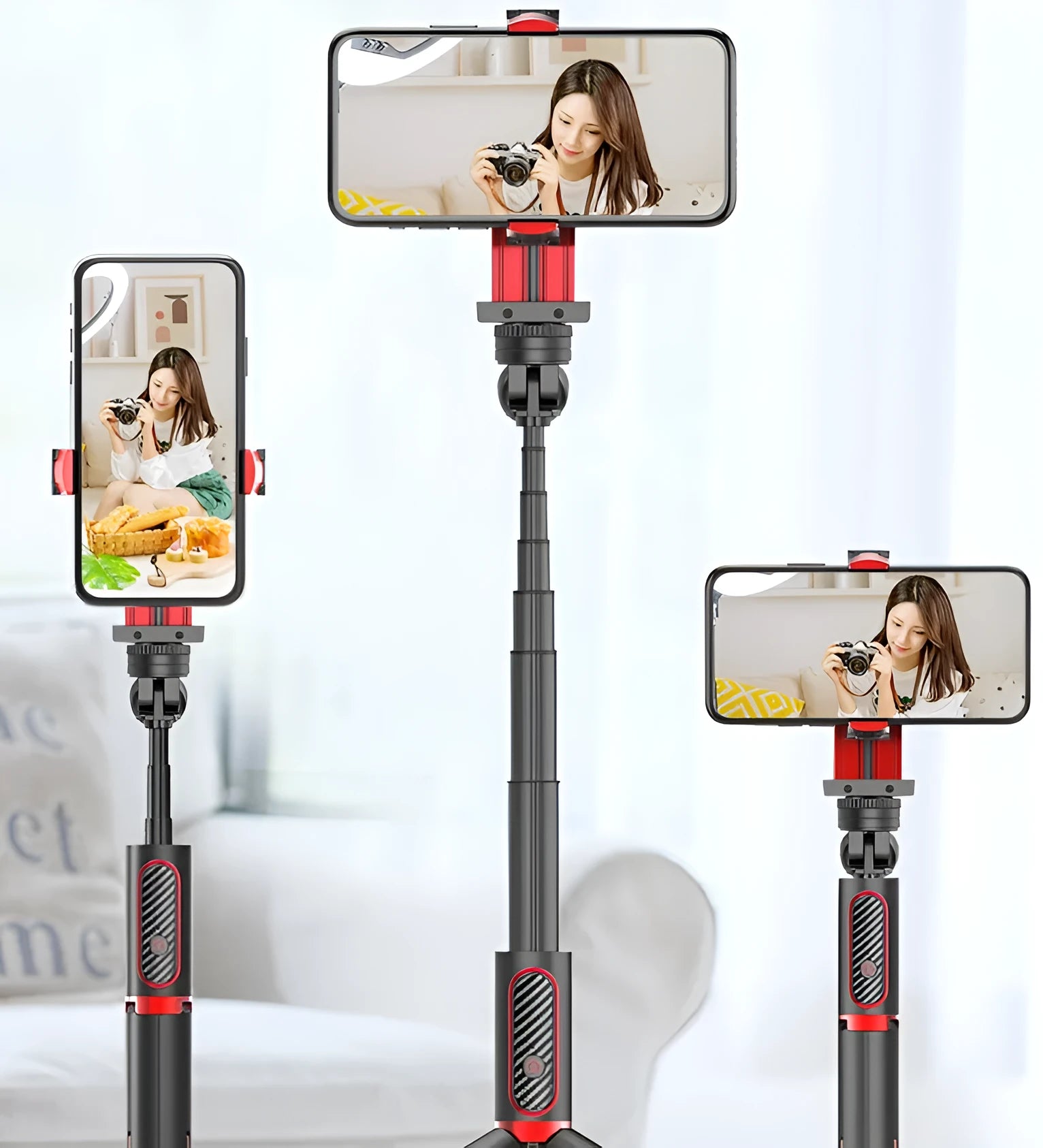 Black aluminium tripod extended to full height with a mobile phone clamped, showing the video stabiliser mechanism.