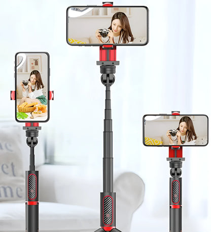 Black aluminium tripod extended to full height with a mobile phone clamped, showing the video stabiliser mechanism.