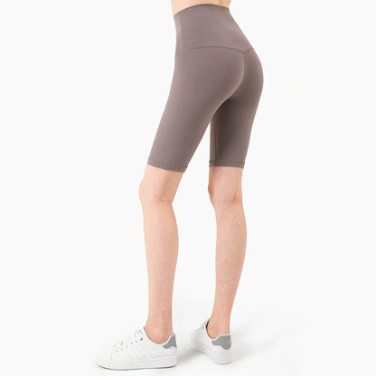 Women's yoga pants with five-point design in tidewater teal colour showing moisture-wicking nylon fabric