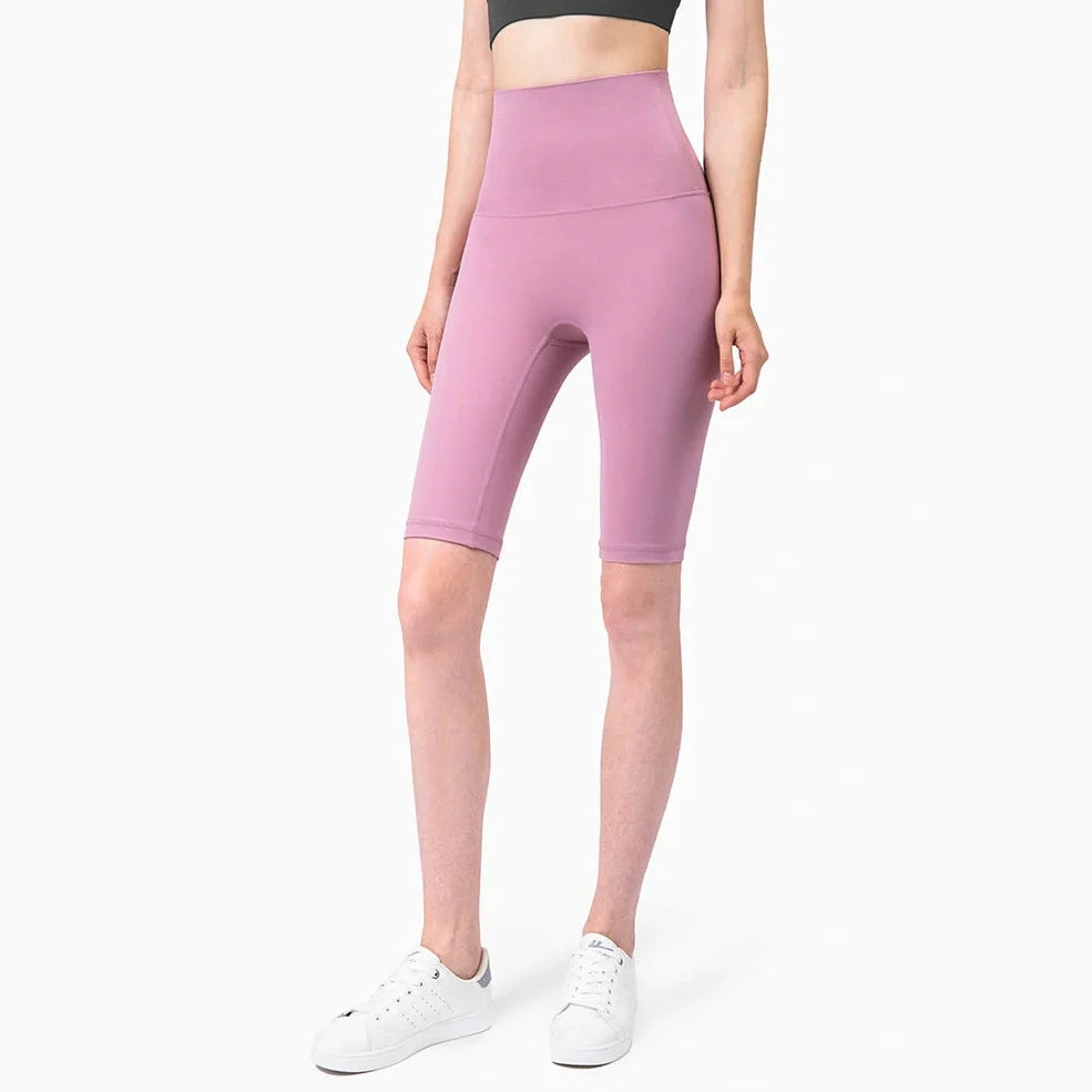 Women's yoga pants with five-point design in tidewater teal colour showing moisture-wicking nylon fabric