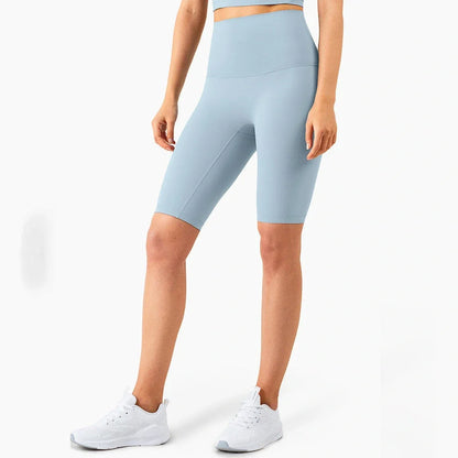 Women's yoga pants with five-point design in tidewater teal colour showing moisture-wicking nylon fabric