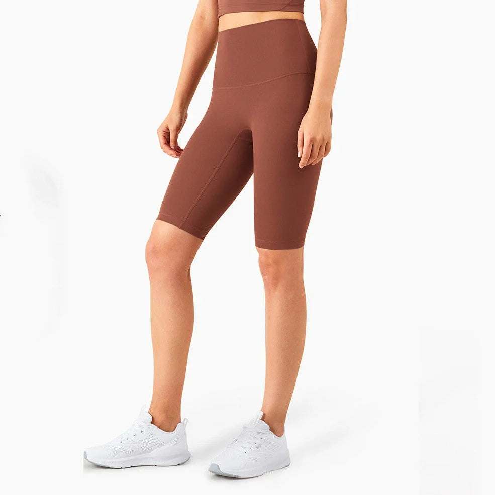 Women's yoga pants with five-point design in tidewater teal colour showing moisture-wicking nylon fabric