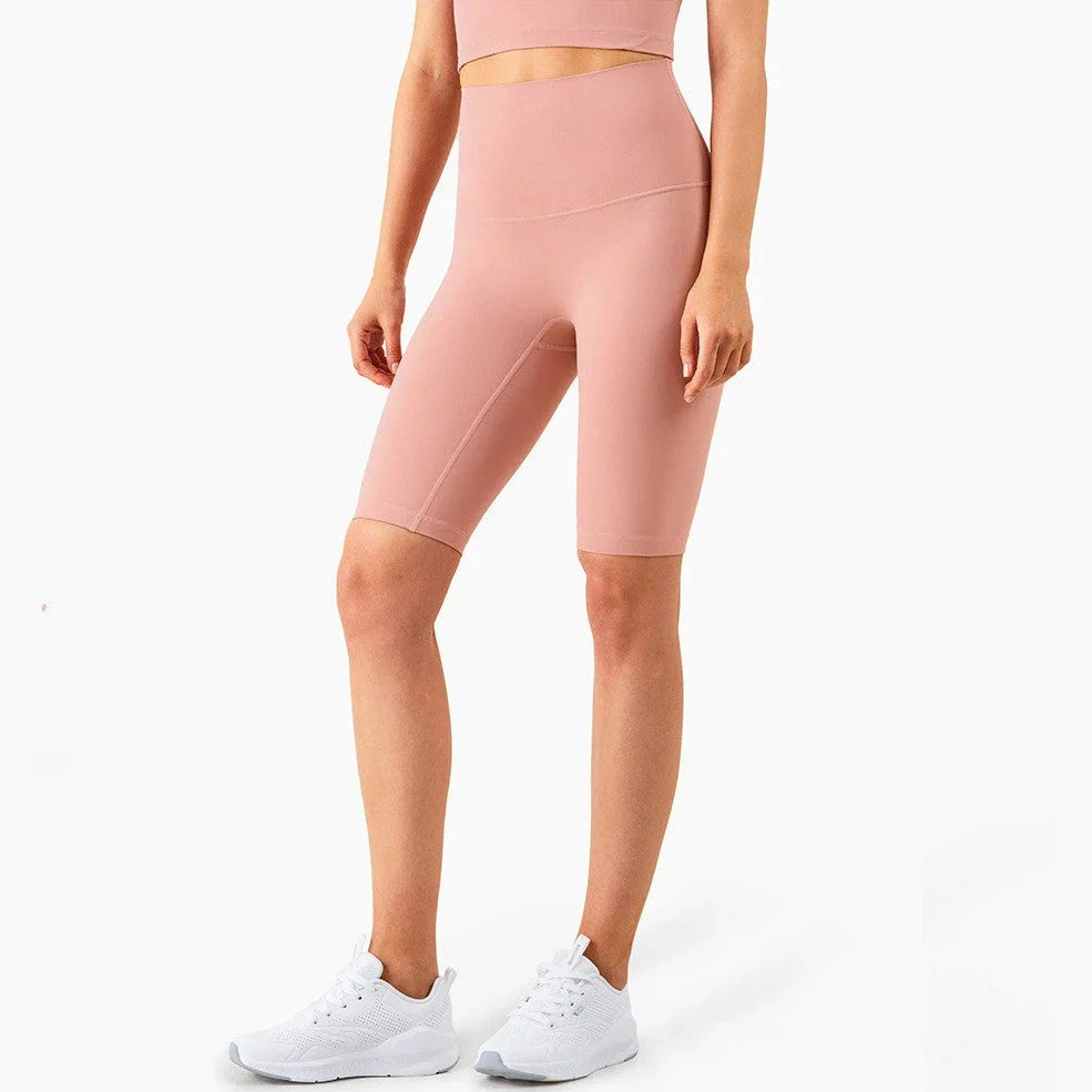 Women's yoga pants with five-point design in tidewater teal colour showing moisture-wicking nylon fabric