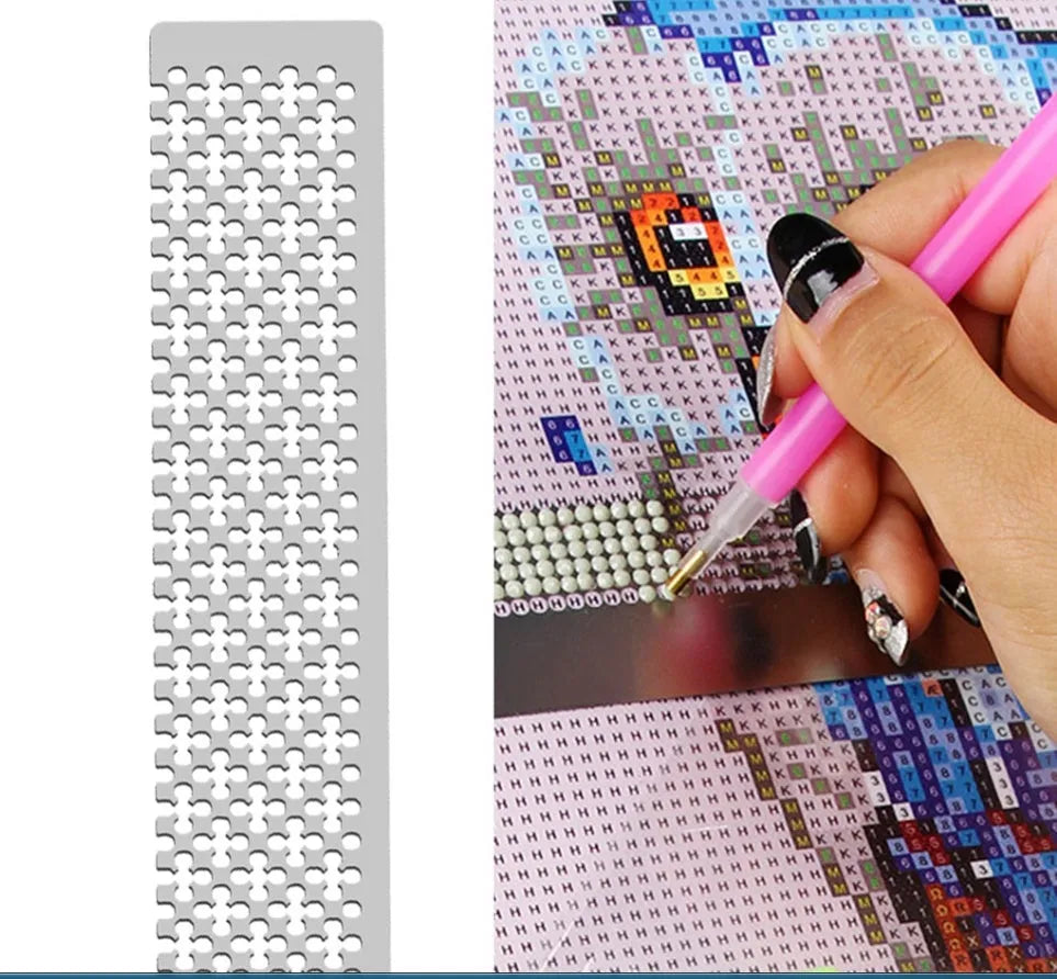 Stainless steel diamond painting grid ruler for round and square drills on a craft table.