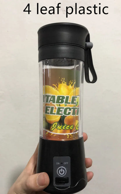 Pink portable USB electric fruit juicer blender cup with stainless steel blade and carry handle.