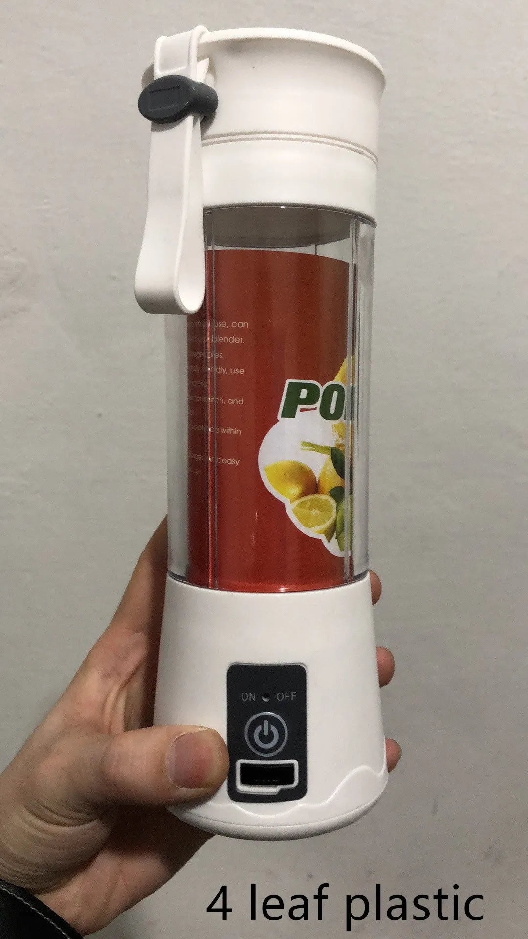 Pink portable USB electric fruit juicer blender cup with stainless steel blade and carry handle.