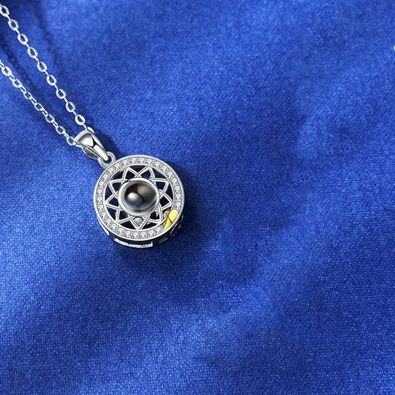 Personalized Sun and Moon Projection Necklace showcasing 100 languages I love you engraving