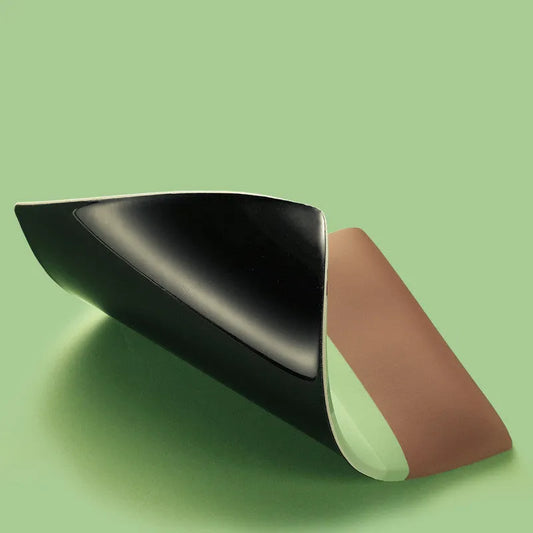 Green kiwi-shaped mouse pad with 20mm thick silicone wrist support on office desk