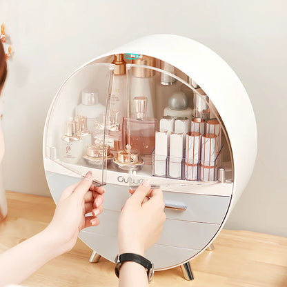 Grey desktop storage organiser with drawer open showing cosmetic storage capacity