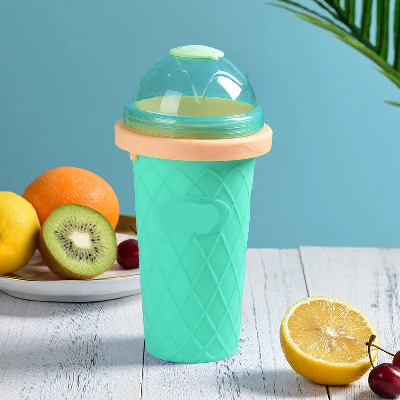 Silicone quick-freeze slush maker cup in mint green with lid and straw spoon