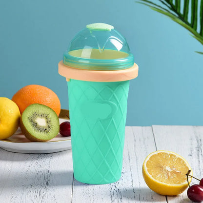 Silicone quick-freeze slush maker cup in mint green with lid and straw spoon