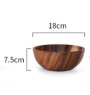 Brown handmade wooden serving bowl with natural wood grain on a table.