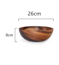 Brown handmade wooden serving bowl with natural wood grain on a table.