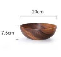 Brown handmade wooden serving bowl with natural wood grain on a table.
