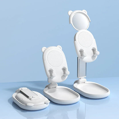 Adjustable desk phone stand with mirror for iPhones and iPads, featuring a sleek and versatile design for hands-free use and on-the-go touch-ups.