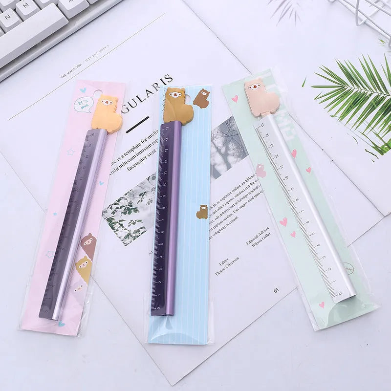 30 centimetre silver aluminum ruler with black measurement markings on a white background