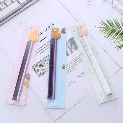 30 centimetre silver aluminum ruler with black measurement markings on a white background