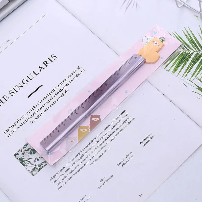 30 centimetre silver aluminum ruler with black measurement markings on a white background