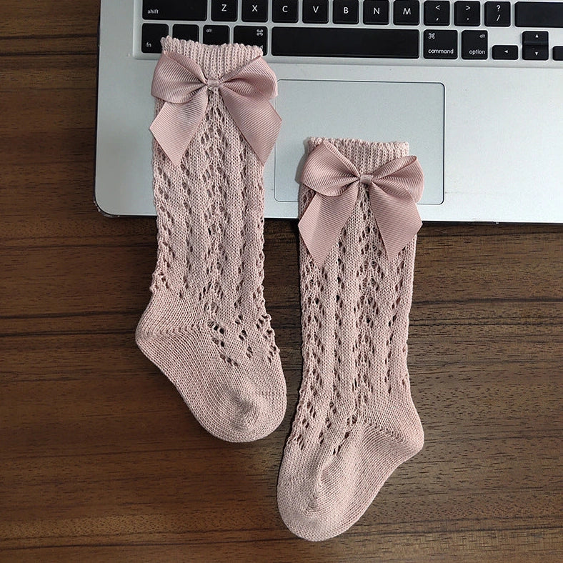 Girls' cotton knee-high socks with decorative bows and hollow-out patterns in navy blue colour