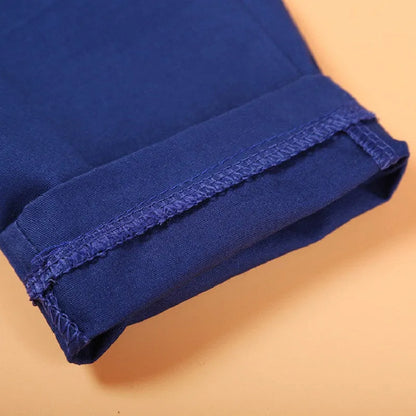 Blue boys' suit clothing set with vest, tie, turtleneck and trousers on hanger