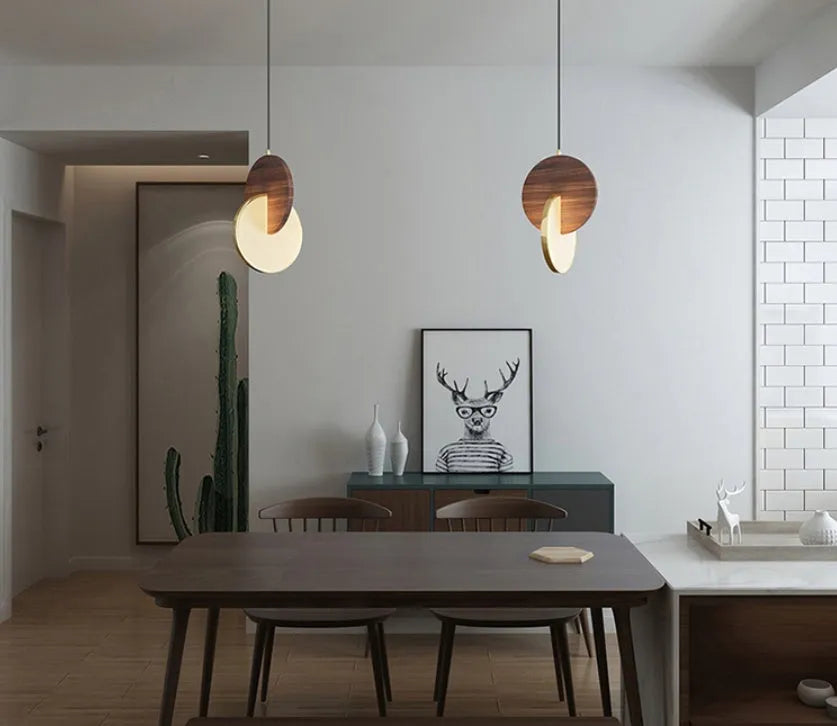 Long-line walnut wood chandelier with carved details and warm white lighting