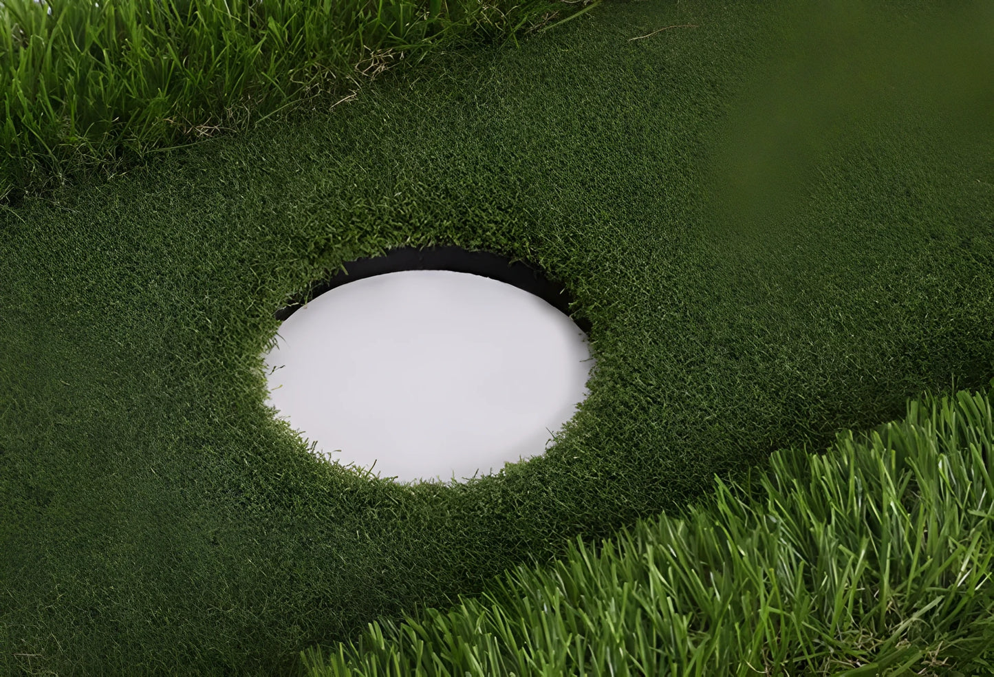 Green golf training mat with artificial grass surface and EVA foam base for indoor and outdoor practice