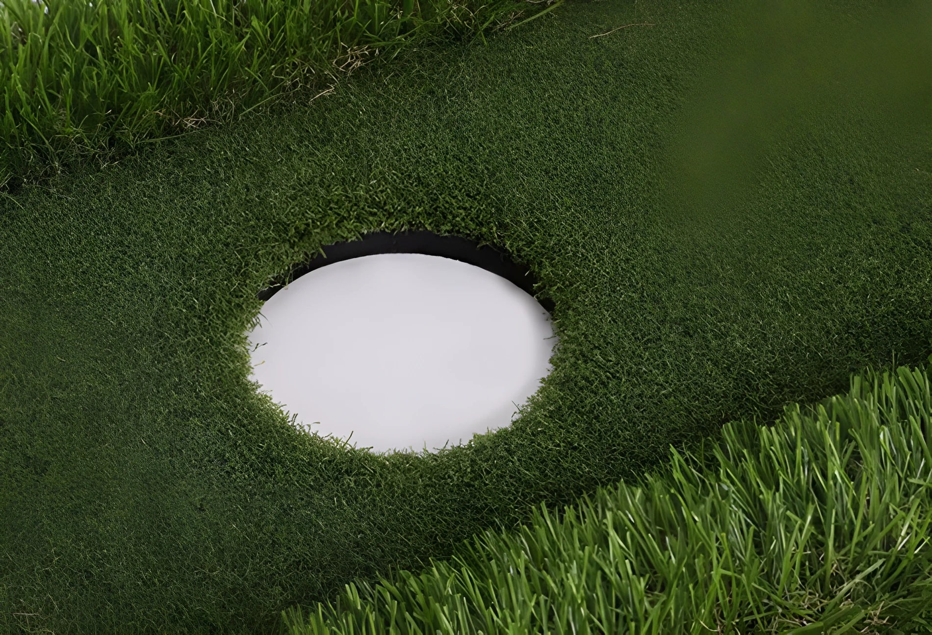 Green golf training mat with artificial grass surface and EVA foam base for indoor and outdoor practice