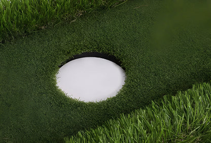 Green golf training mat with artificial grass surface and EVA foam base for indoor and outdoor practice