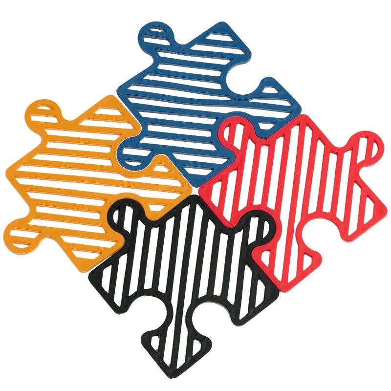 Creative Household Splicing Jigsaw Insulation Pad in blue, black, red, and yellow