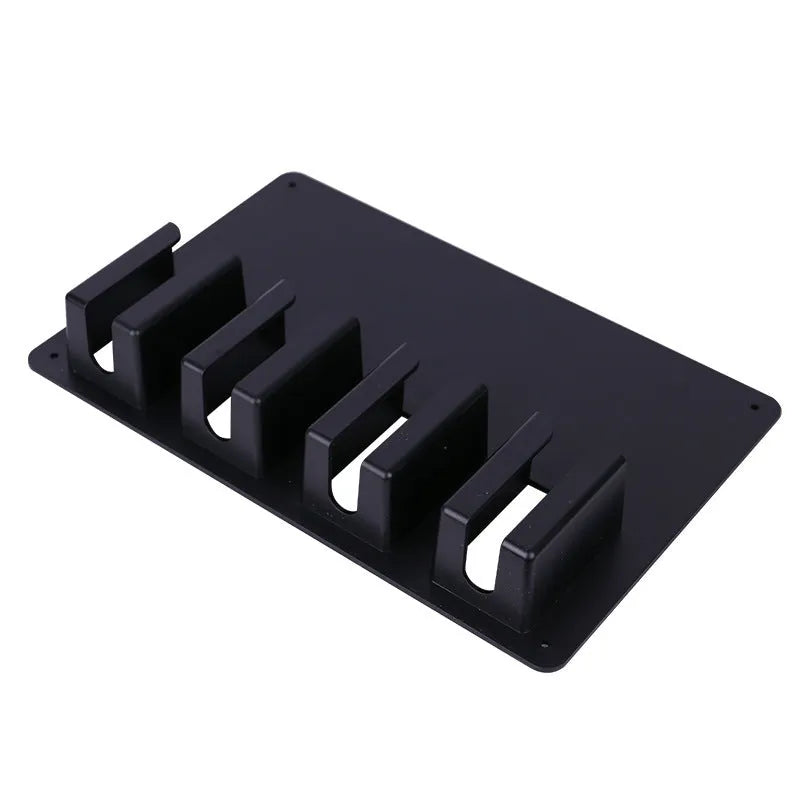 Black plastic wall-mounted hairdressing clipper display box holding four electric clippers