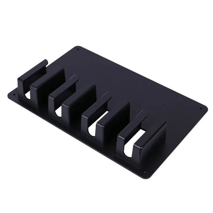 Black plastic wall-mounted hairdressing clipper display box holding four electric clippers