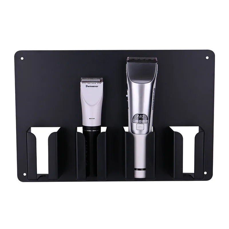Black plastic wall-mounted hairdressing clipper display box holding four electric clippers