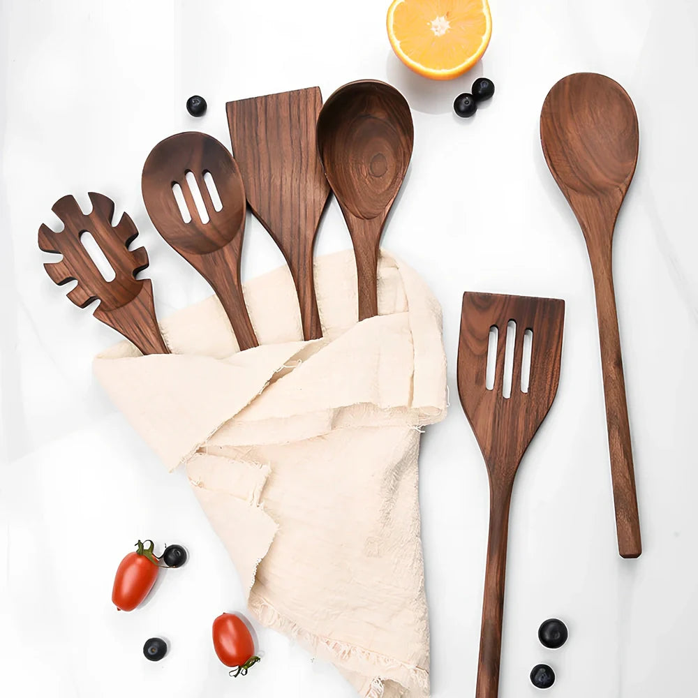 Black walnut wooden kitchen utensil set with six pieces including shovel, spatula, spoons, and spaghetti claws