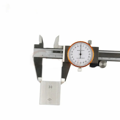 Black and white plastic vernier caliper showing 0-150mm scale with 0.1mm graduations